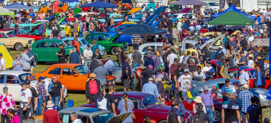 Crowd of people and cars at RACQ Motorfest